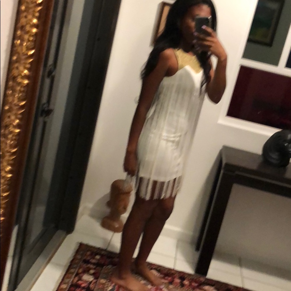 Cute white and gold dress with tassels